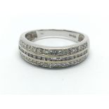 An 18ct white gold ring set with three rows of dia