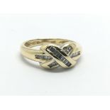 An 18ct gold diamond crossover ring, approx .25ct,