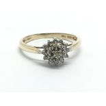 A gold diamond cluster ring, approx 1.8g and appro