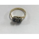 A 18 ct gold ring inset with sapphires Size M Tota