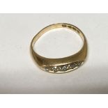 An 18carat gold ring set with a row of five diamonds ring size M.