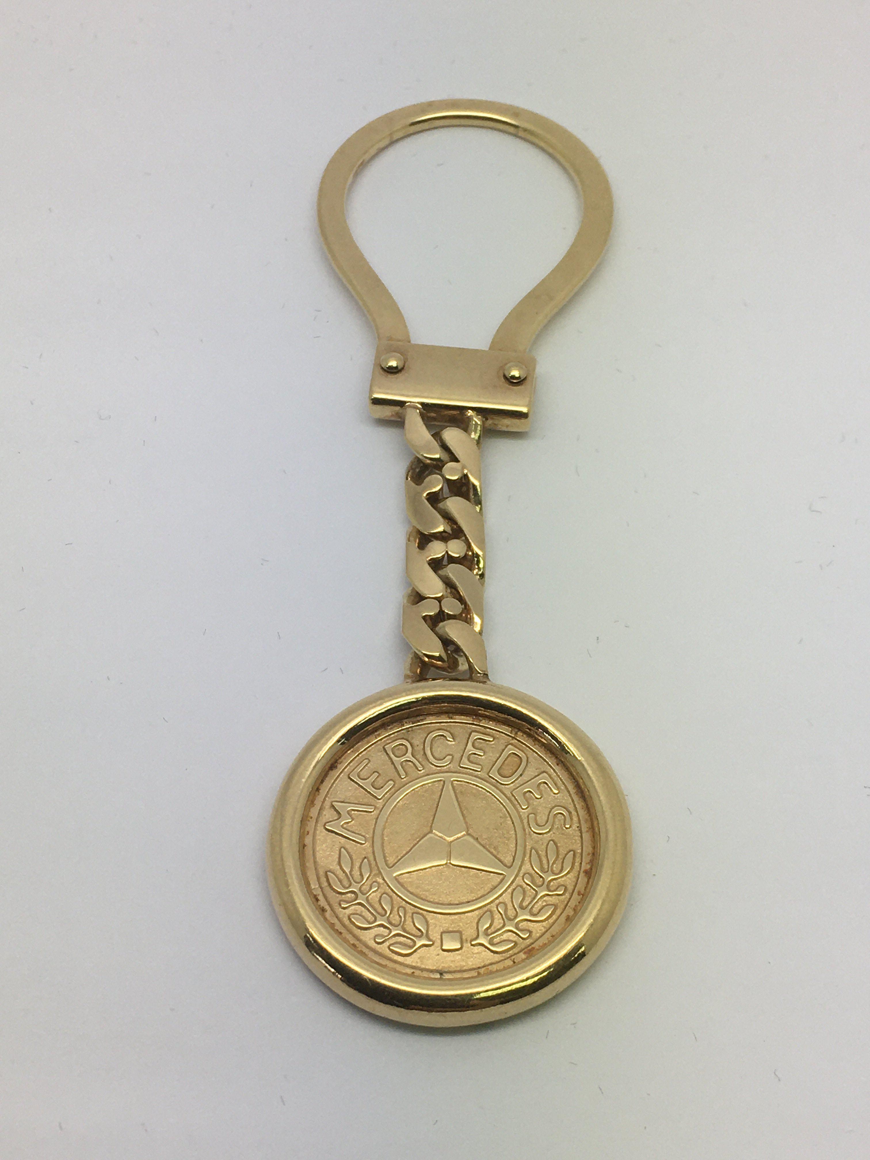 A 9ct gold Mercedes key ring, approx 14.7g.