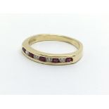 An 18ct gold half eternity ring set with alternati