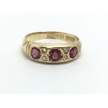 An 18ct gold ruby and diamond ring, approx 2.7g an