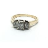 An 18ct gold ring set with three millenium cut dia