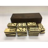 A collection of ivory dominos, 27 in total.