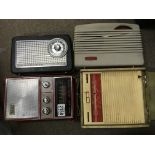 4 vintage portable radios.