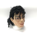 A rubber mask depicting Michael Jackson