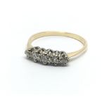An 18ct gold and platinum five stone diamond ring,
