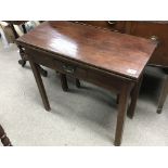 A George III mahogany and oak tea table with a single drawer