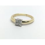 An 18ct gold diamond ring set with four princess c