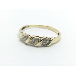 A 9ct gold ring set with small diamonds, approx 1.