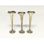 Three silver fluted bud vases marked approx Birmingham 1906