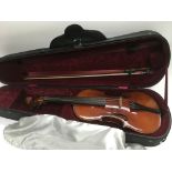 An interesting early 20th Century Strad copy violin. Includes case and bow.