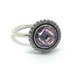 A silver Pandora ring set with an amethyst, approx R-S.