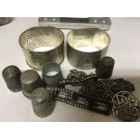 A collection of silver napkin thimbles some silver and brooches (a lot)
