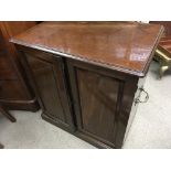 A Victorian Mahogany cupboard the sides with solid brass handles 81x53cm