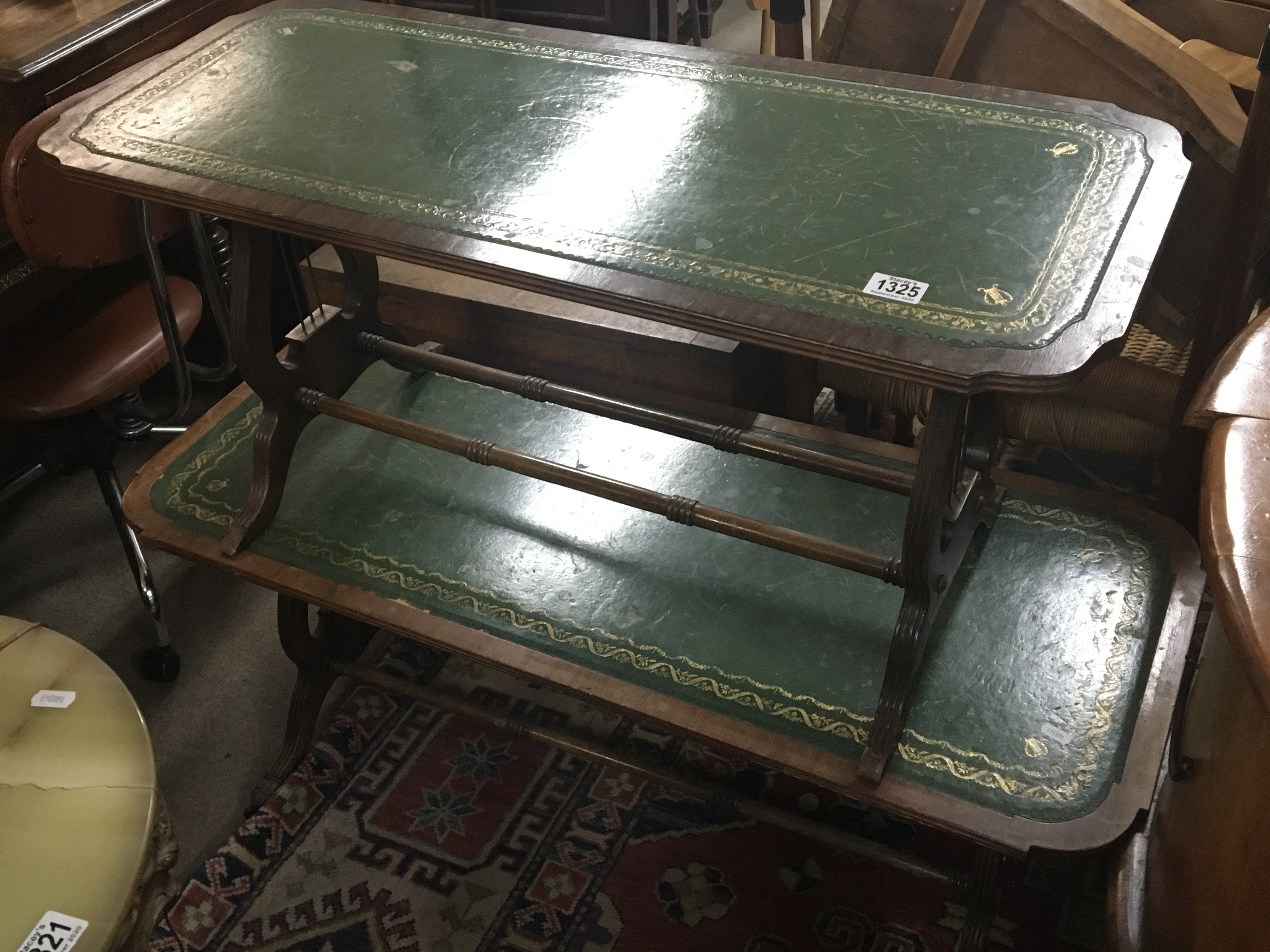 Two mahogany occasional tables with green leather