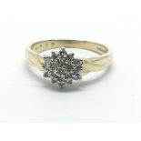 A 9ct gold diamond cluster ring in the form of a flowerhead, approx 1/4ct, approx 2.7g and approx