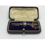 A 15ct gold bar brooch set with an aquamarine, app