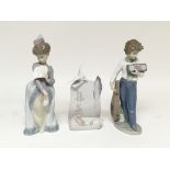 Three Lladró figures including a Lladro society scroll