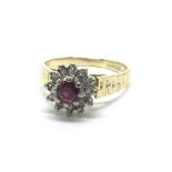 An 18ct gold ruby and diamond cluster ring, approx