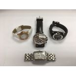 Four designer watches including Boss, DKNY etc.