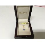 A 9carat gold necklace with pendent set with a blue stone and CZ stones
