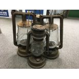 Four Victorian hurricane lamps