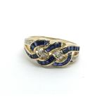 A gold sapphire and diamond swirl ring, approx 3.8