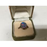 A 9carat gold ring inset with an opal (opal cracked)