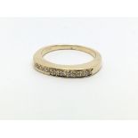 An 18ct gold half eternity ring, approx .12ct, app