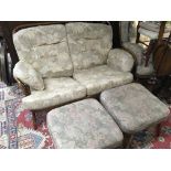 An Ercol modern design lounge suite. With a shaped