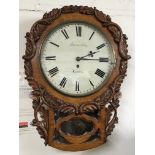 A Victorian oak single Fusee wall clock maker Brambles of Leeds the case with carved oak leaf and