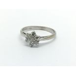 An 18ct white gold seven stone diamond ring in the