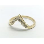 An 18ct gold diamond wishbone ring, approx.33ct, a