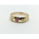 A vintage 18ct gold ruby and two diamond ring, app