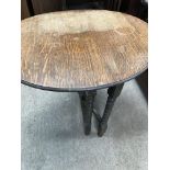 A small oak drop leaf occasional table on Bobin tu