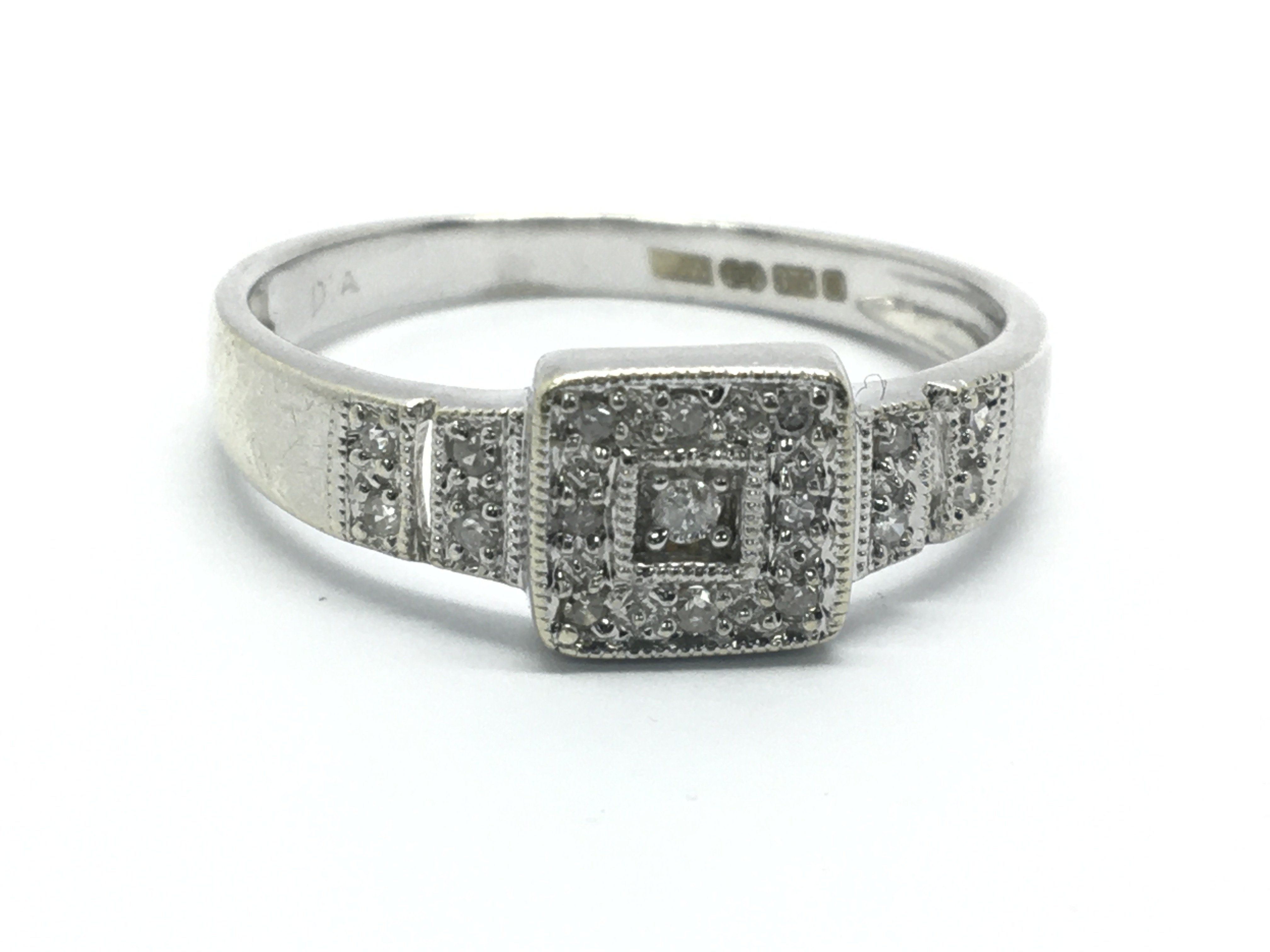 An 18ct white gold diamond cluster ring of squared