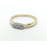 An 18ct gold three stone diamond ring, approx 2.7g