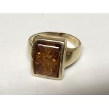 A 9carat gold ring set with amber ring size O