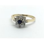 An 18ct gold sapphire and diamond cluster ring in