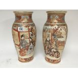 A pair of late 19th century Japanese satsuma vases decorated with figures. Height 38cm no damage