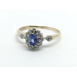 A 9ct gold ring set with a central Ceylon sapphire
