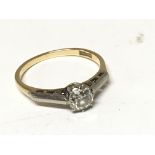 An 18carat gold ring set with a solitaire diamond old cut diamond 0.50 of a carat approximately.