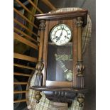 A Vienna type walnut cased wall clock with visible