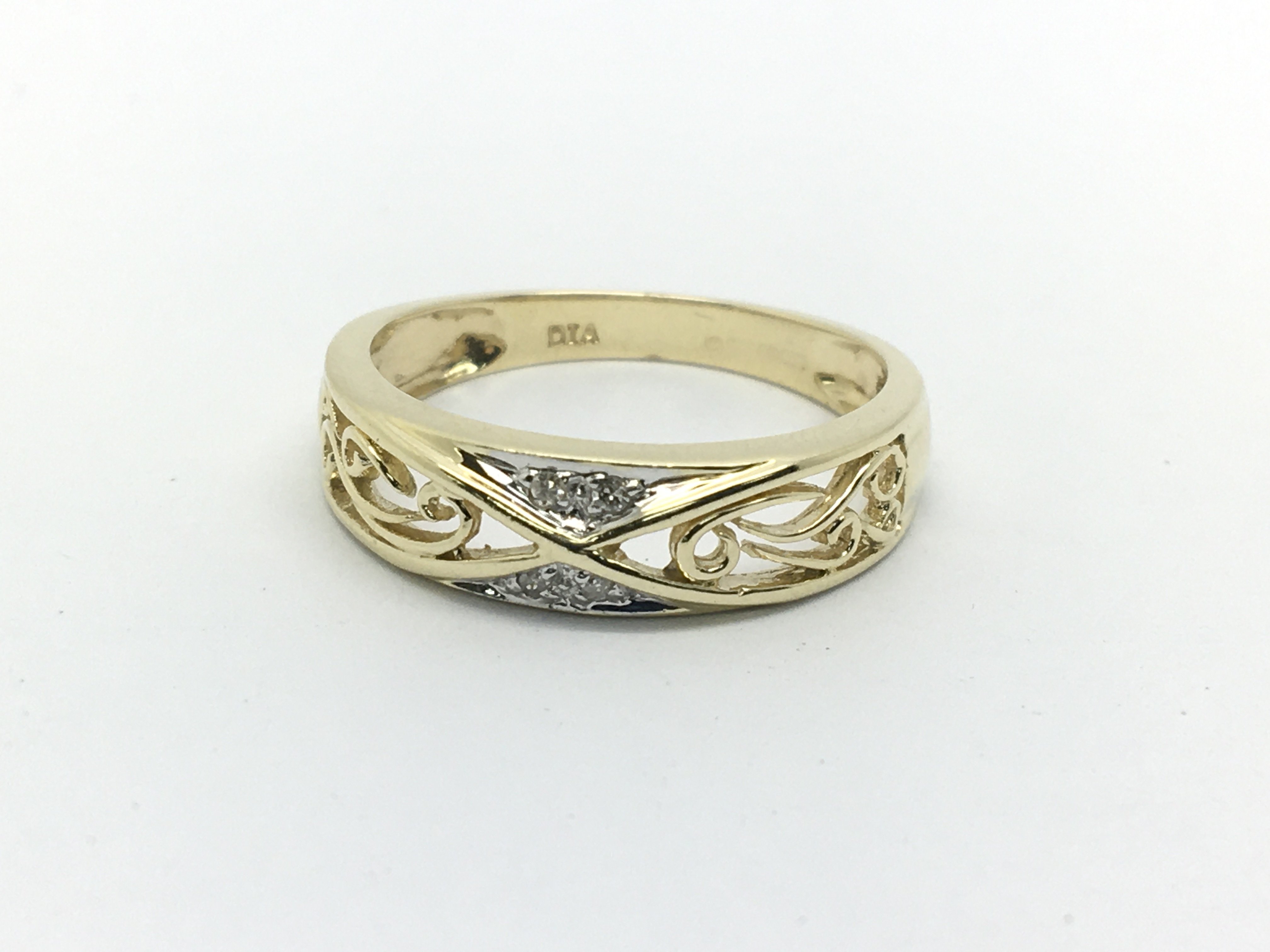 A 9ct gold open work ring set with small diamonds,