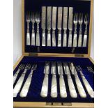 A cased set of silver spoons , a case containing part set of fruit knifes and a cased set of fish