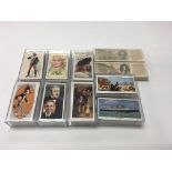 A collection of 10 cigarette card sets including Ogdens “ AFC “ , Churchmans “ The Queen Mary “, and