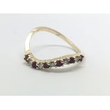 A 14ct gold ruby and diamond twist ring, approx 2g
